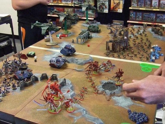  Picture of board game where 2 armies fight.